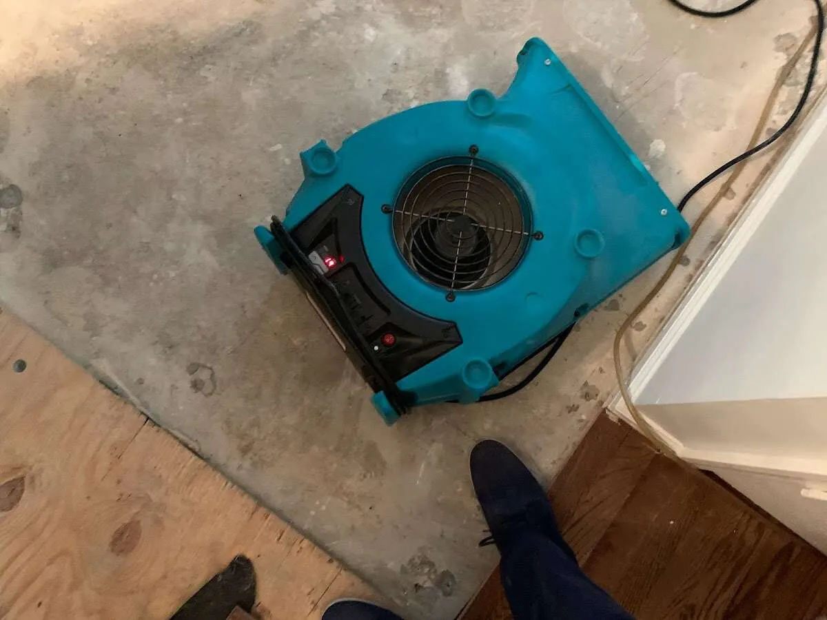 Air mover drying subfloor during Leak Detection & Repair in Garnet
